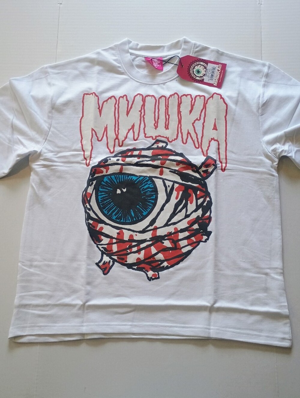 Mishka Mummy Eyeball Graphic White T-Shirt. Size Medium
